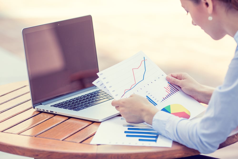 Woman analyzing consulting results and graphs to implement in her buiness